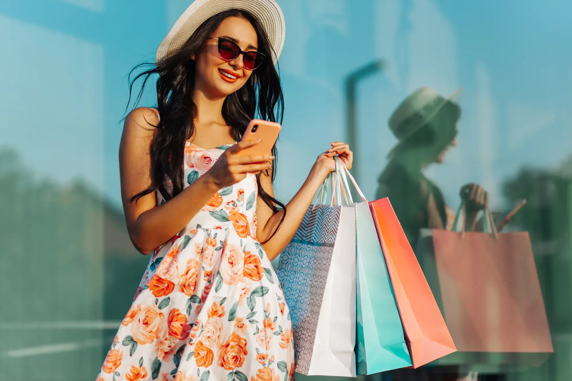 A shopper using the Shopwalk app on her phone in a mall